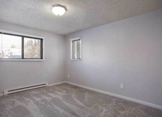Living room of an empty house with a window  at Governor's Park, Fort Collins, 80525